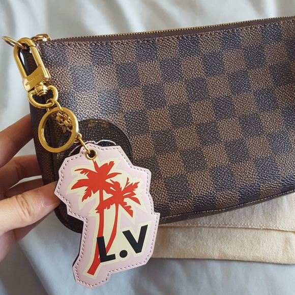 Excellent authentic Louis Vuitton bag charm